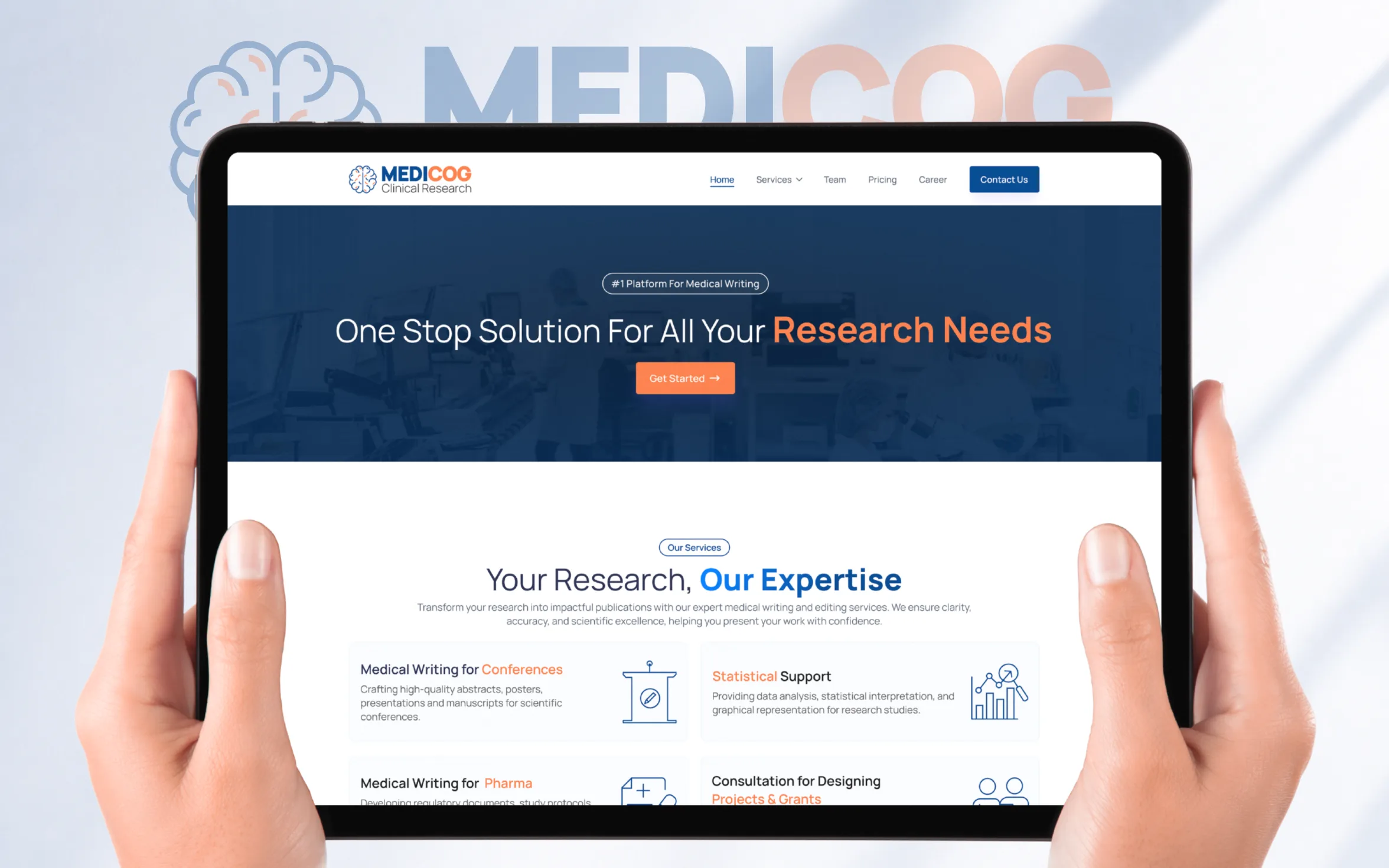 MediCog clinical research website displayed on a tablet, featuring medical writing, statistical support, research consulting, and publication services.